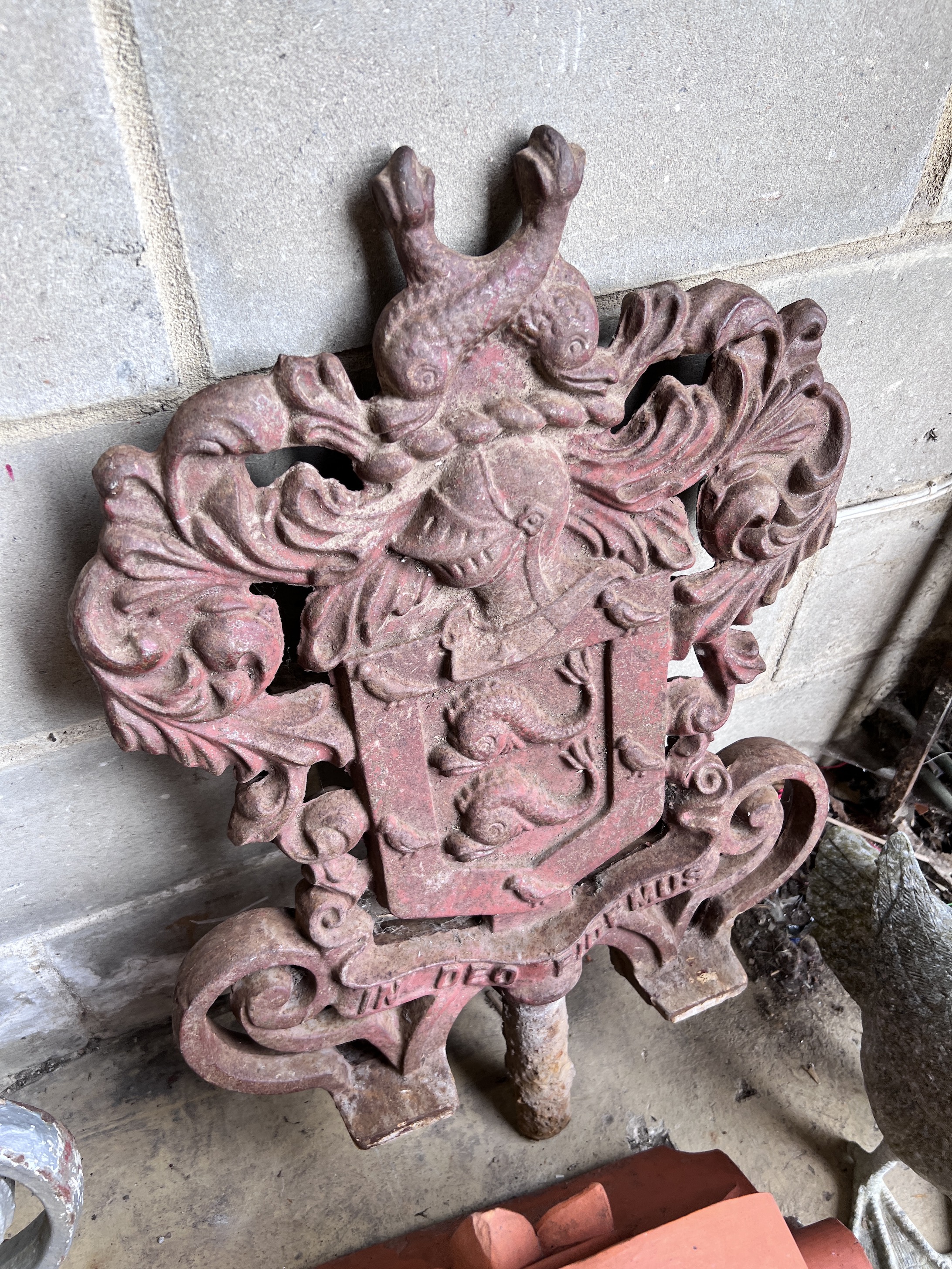 A pair of cast iron armorial capitals with motto 'In Deo Fidemus', height 82cm